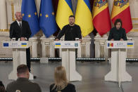 FILE - President of Moldova Maia Sandu, right, speaks during a joint press conference with European Council President Charles Michel, left, and Ukrainian President Volodymyr Zelenskyy in Kyiv, Ukraine, Tuesday, Nov. 21, 2023. The European Union agreed Friday, June 21, 2024, to start membership negotiations with embattled Ukraine and Moldova, another step in the nations' long journey to move closer to the West and mute Russia's influence. (AP Photo/Efrem Lukatsky, File)