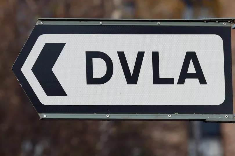 a sign for DVLA offices