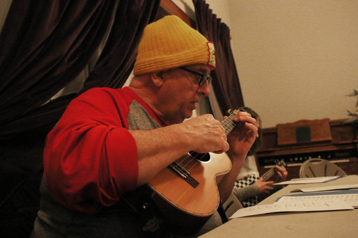 Keith Arnold of Shawnee gets to grips with his ukulele during a class at Shawnee Town.