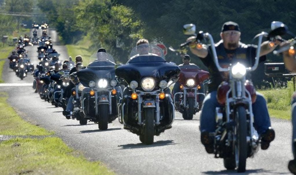 Motorcyclists ride east on Harborgreene Road during the Fallen Riders Memorial Run on Wednesday, July 17, the first day of Roar on the Shore activities. [GREG WOHLFORD/ERIE TIMES-NEWS]