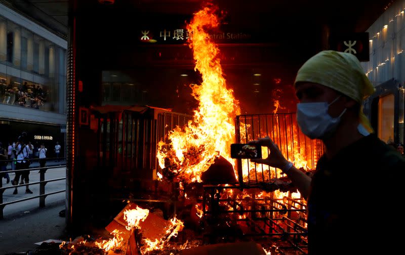 Pictures of the Year: Hong Kong protest tide turns into sea of flames