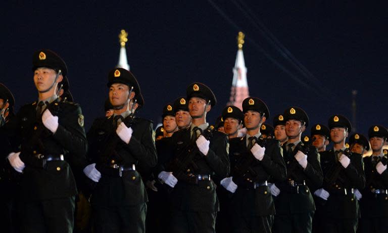 Chinese soldiers attend the Victory Day military parade night training on May 4, 2015 on Red Square in Moscow