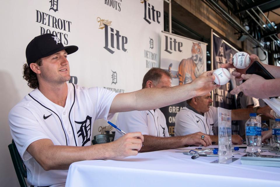 Tigers pitcher Casey Mize signs autographs for fans during the Summer Baseball Bash at Comerica Park in Detroit, Saturday, July 17, 2021.