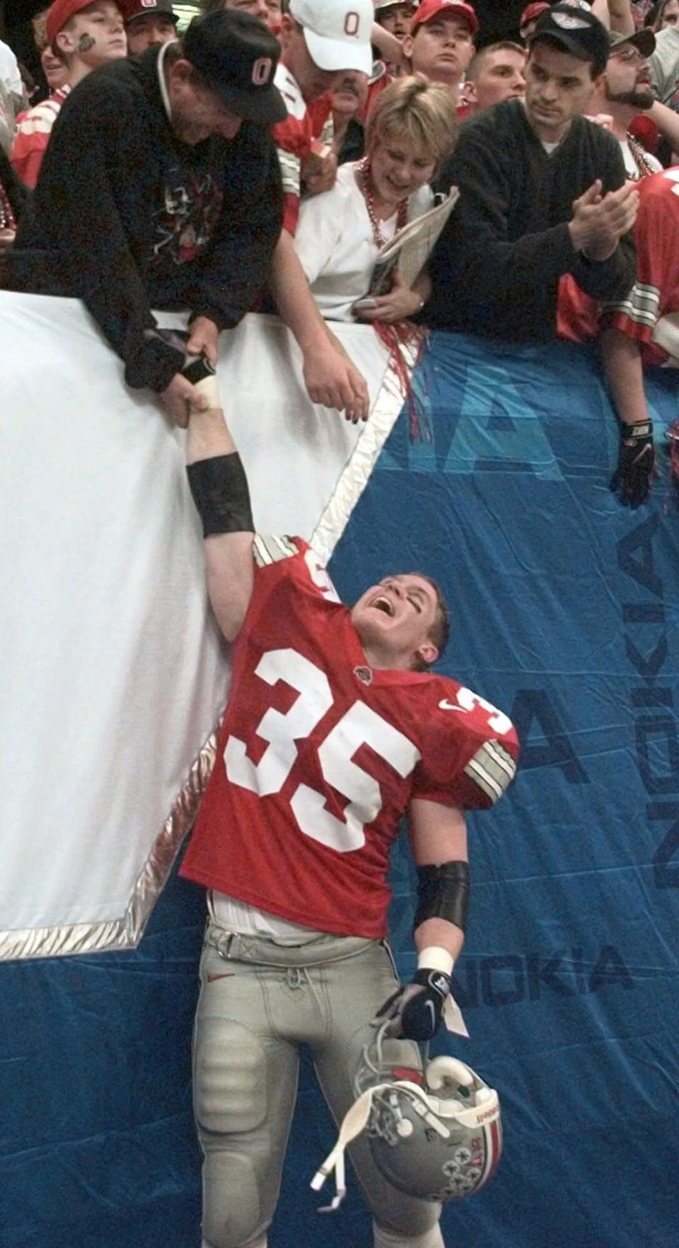 Ohio State linebacker Jerry Rudzinski celebrates with fans after the Buckeyes win over Texas A&M, 24-14, in the 1999 Sugar Bowl.