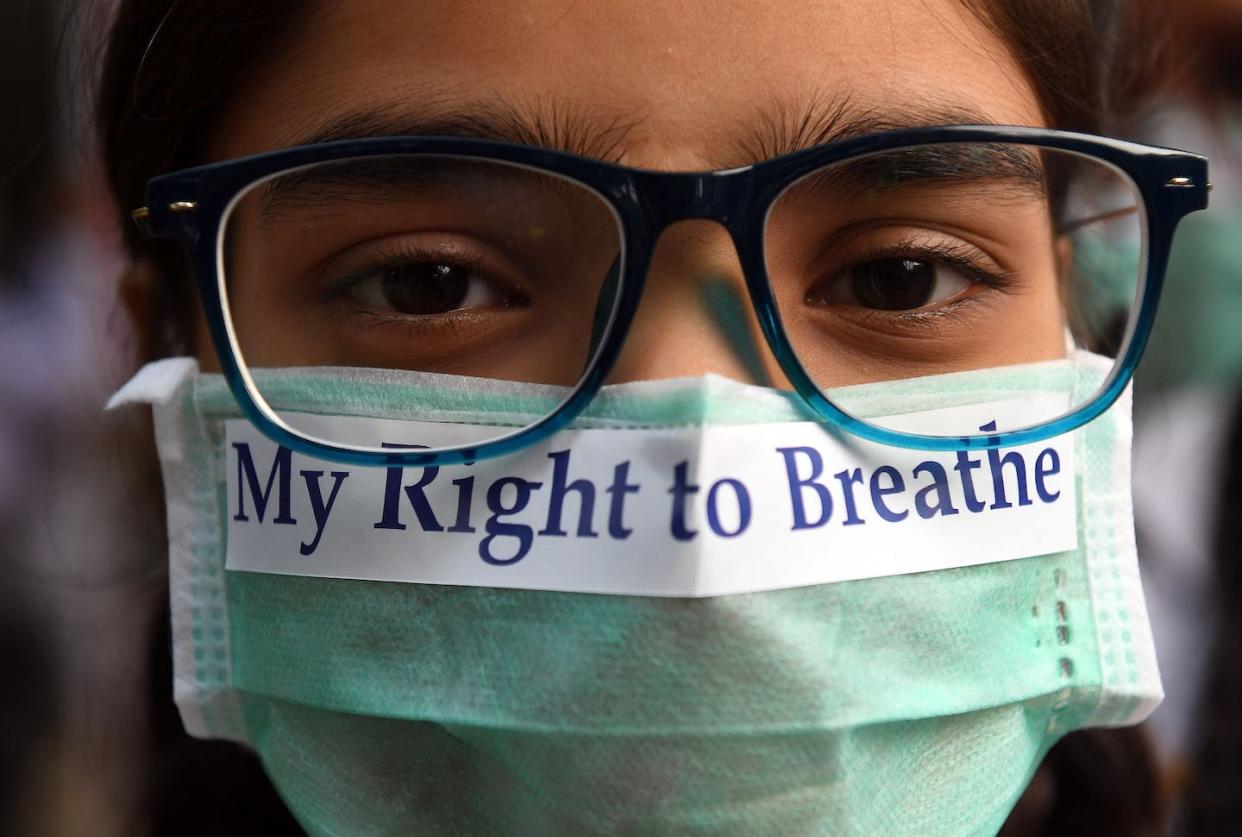 A young protester in India makes a statement about dangerous levels of air pollution. <a href="https://www.gettyimages.com/detail/news-photo/an-indian-youth-wearing-a-pollution-mask-participates-in-a-news-photo/874336822" rel="nofollow noopener" target="_blank" data-ylk="slk:Prakash Singh/AFP via Getty Images;elm:context_link;itc:0;sec:content-canvas" class="link ">Prakash Singh/AFP via Getty Images</a>