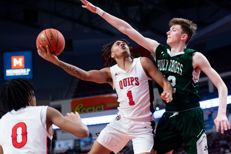 Aliquippa's Brandon Banks (1) tries to hit a shot during the PIAA Class 2A Boys Basketball Championship against Holy Cross at the Giant Center on March 22, 2024, in Hershey. The Quips won, 74-52, to claim their sixth title in program history.