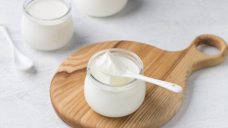 Greek yogurt on wooden board