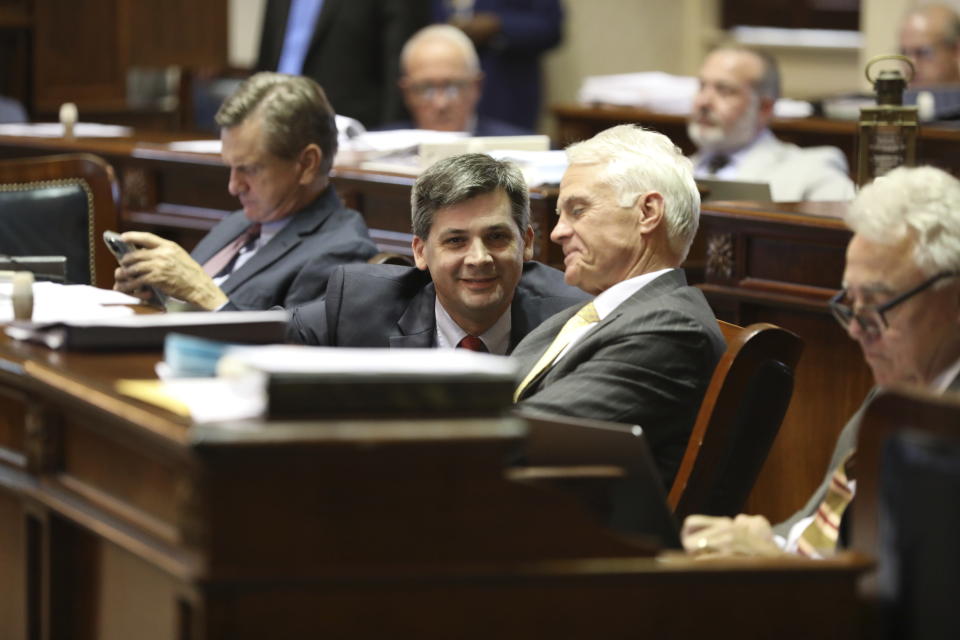 South Carolina Senate Majority Leader Shane Massey, R-Edgefield, left, and Sen. Chip Campsen, R-Isle of Palms, right, talk as the Senate debates a bill that would ban gender-affirming care for transgender minors on Wednesday, May 1, 2024, in Columbia, S.C. (AP Photo/Jeffrey Collins)