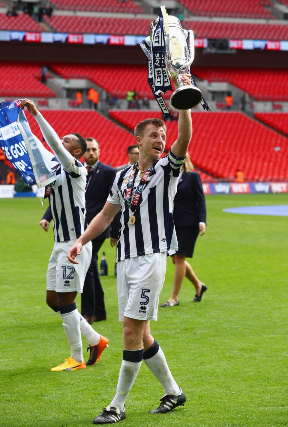 Millwall skipper Tony Craig with the League One Play-off trophy