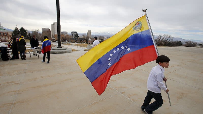 Venezuelans were the largest bloc of newcomers to Utah from 2012-2022, according to numbers released Tuesday. The photo shows a boy carrying a Venezuelan flag at a Feb. 22, 2014, demonstration in Salt Lake City.