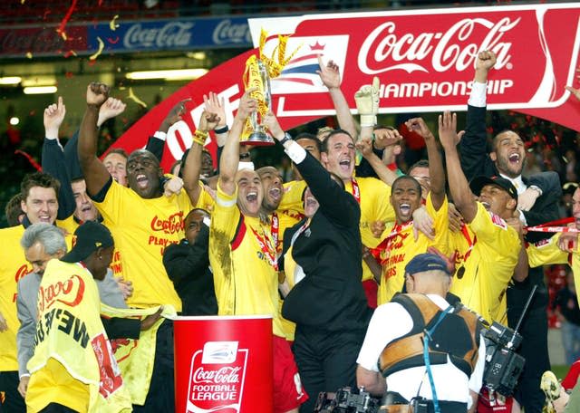 Watford's players celebrate with the trophy after defeating Leeds in the Championship play-off final at the Millennium Stadium