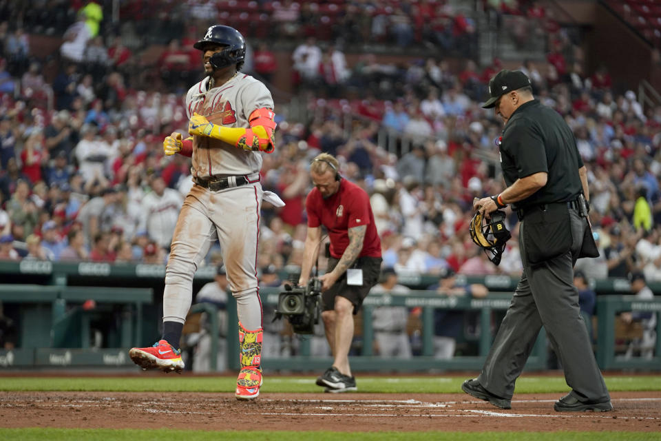 Atlanta Braves' Ronald Acuna Jr. celebrates as he arrives home after hitting a three-run home run during the second inning of a baseball game against the St. Louis Cardinals Monday, April 3, 2023, in St. Louis. (AP Photo/Jeff Roberson)