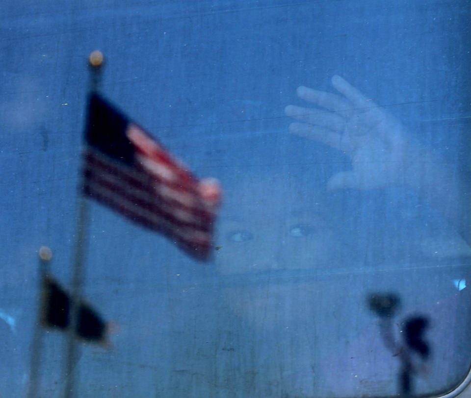 A migrant child looks out the window of a bus at a U.S. Customs and Border Protection detention center in Texas on June 23. (Photo: Spencer Platt via Getty Images)