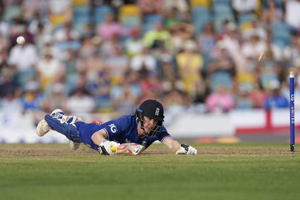 England's Harry Brook is run out by West Indies' Alzarri Joseph during the third ODI cricket match at Kensington Oval in Bridgetown, Barbados, Saturday, Dec. 9, 2023. (AP Photo/Ricardo Mazalan)