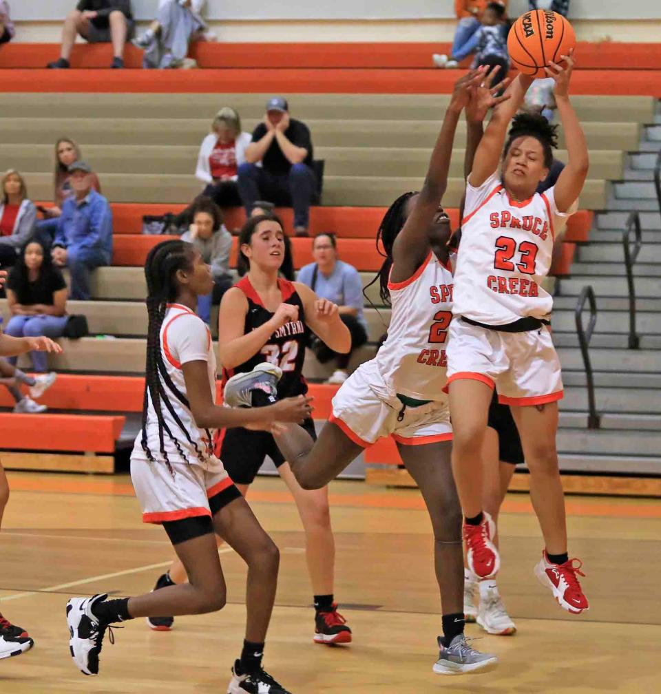 Anastasia Neal (23) gets control of the ball  at the Five Star Conference Tournament as Spruce Creek High School won 78-19 against New Smyrna Beach at University High School on Friday, Jan.20th,2023.