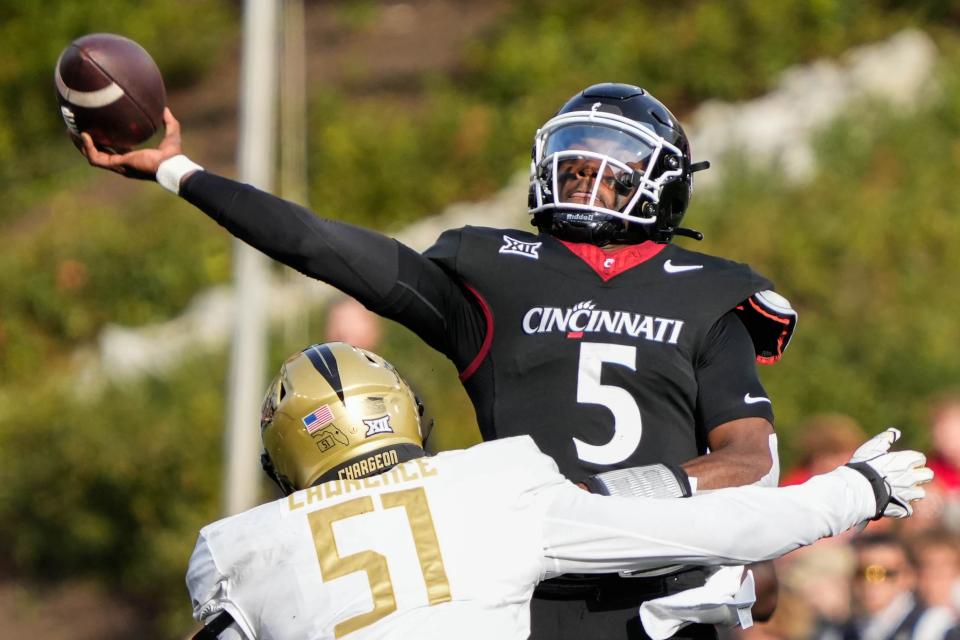 UC's quarterback Emory Jones (5) launches the ball during the UC vs. UCF game at Nippert Stadium on Saturday November 4, 2023. Jones was sacked four times in the 28-26 loss.