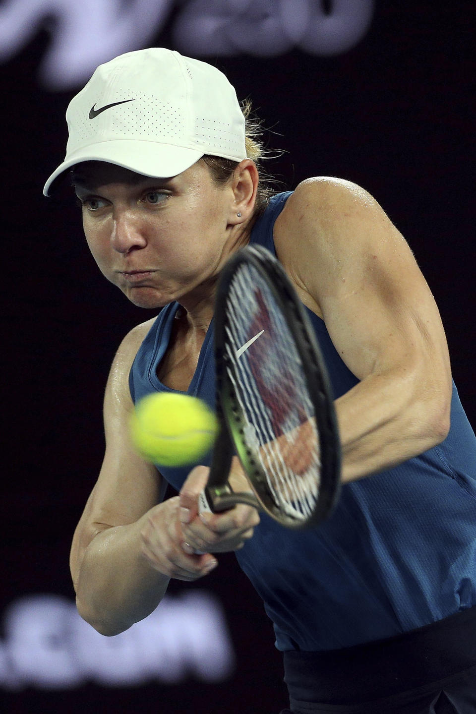 Simona Halep of Romania plays a backhand during her singles match against Elena-Gabriela Ruse of Romania at Summer Set tennis tournament ahead of the Australian Open in Melbourne, Australia, Thursday, Jan. 6, 2022. (AP Photo/Hamish Blair)