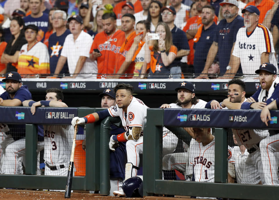 HOUSTON, TX - OCTOBER 10:  Yuli Gurriel #10 of the Houston Astros watches from the dugout in the eighth inning against the Tampa Bay Rays at Minute Maid Park on October 10, 2019 in Houston, Texas.  (Photo by Tim Warner/Getty Images)