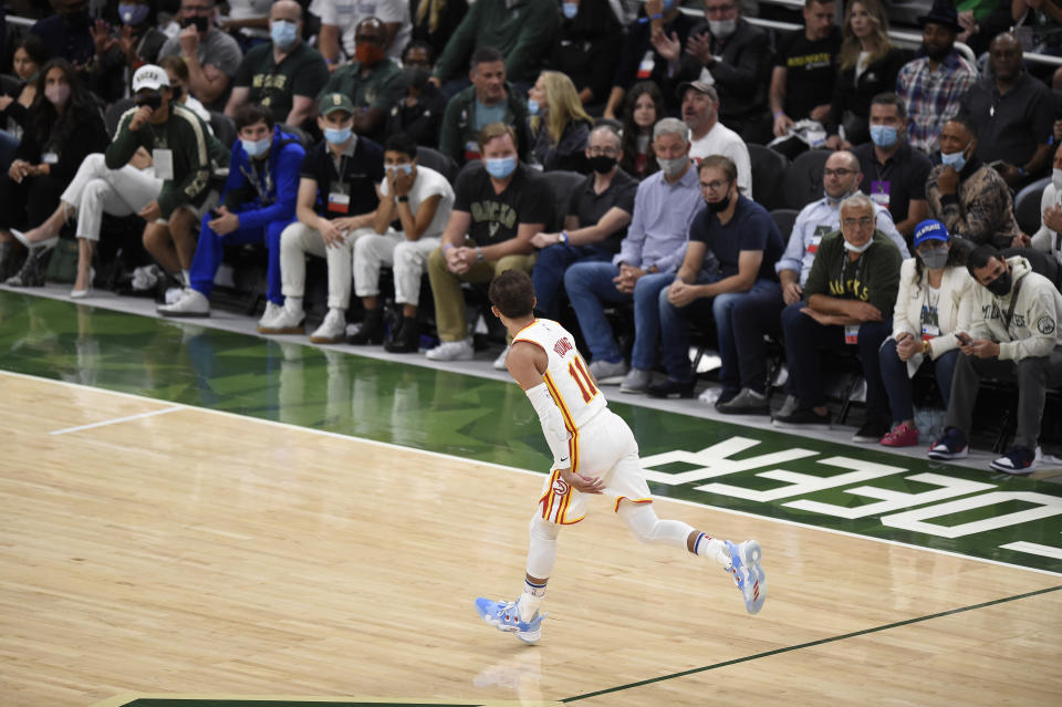 Hawks guard Trae Young celebrates a basket against the Bucks in Game 1 of the Eastern Conference finals. (Patrick McDermott/Getty Images)