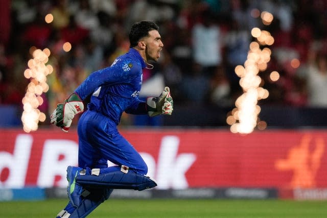 Afghanistan’s Rahmanullah Gurbaz celebrates after taking a catch to dismiss Australia’s Marcus Stoinis