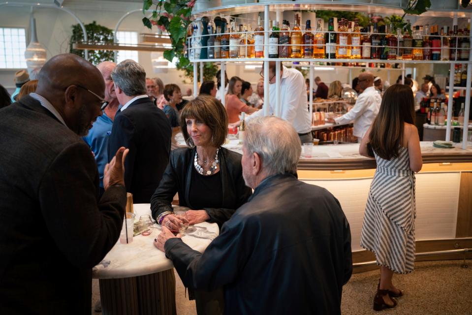 Dennis Carter of Ann Arbor, left, talks with Hazel and Robert Karbel of Huntington Woods, during the third annual EAT Detroit event that benefits SAY Detroit charities at Mad Nice, a modern Italian restaurant, in Midtown Detroit on Tuesday, June 27, 2023.