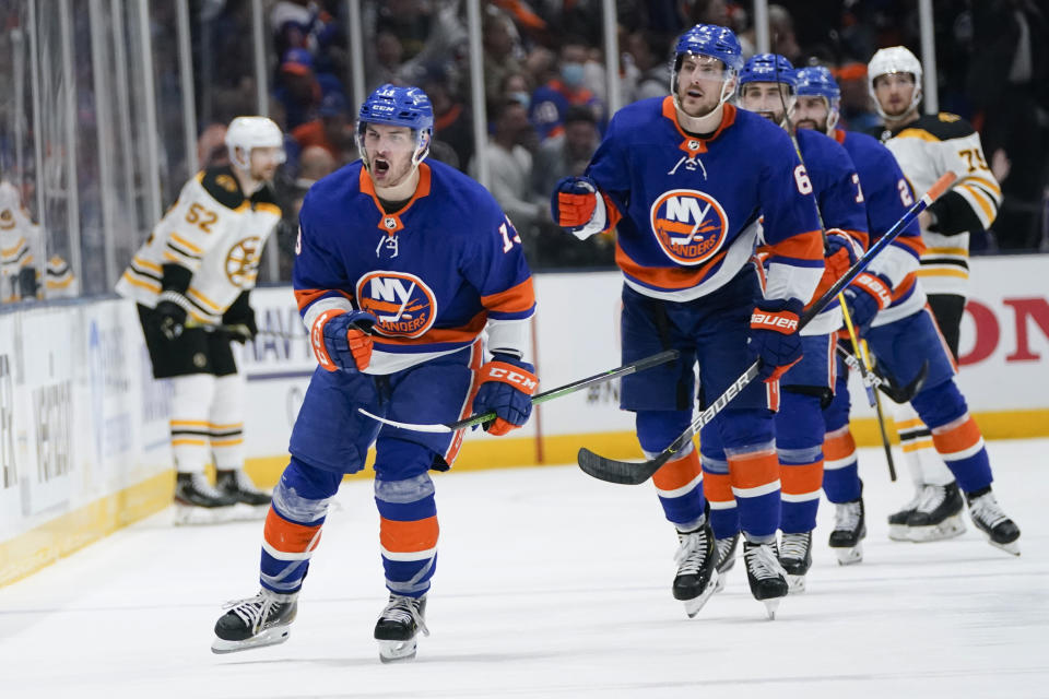 New York Islanders' Mathew Barzal (13) celebrates with teammates after scoring a goal during the third period of Game 3 of the team's NHL hockey second-round playoff series against the Boston Bruins on Thursday, June 3, 2021, in Uniondale, N.Y. (AP Photo/Frank Franklin II)