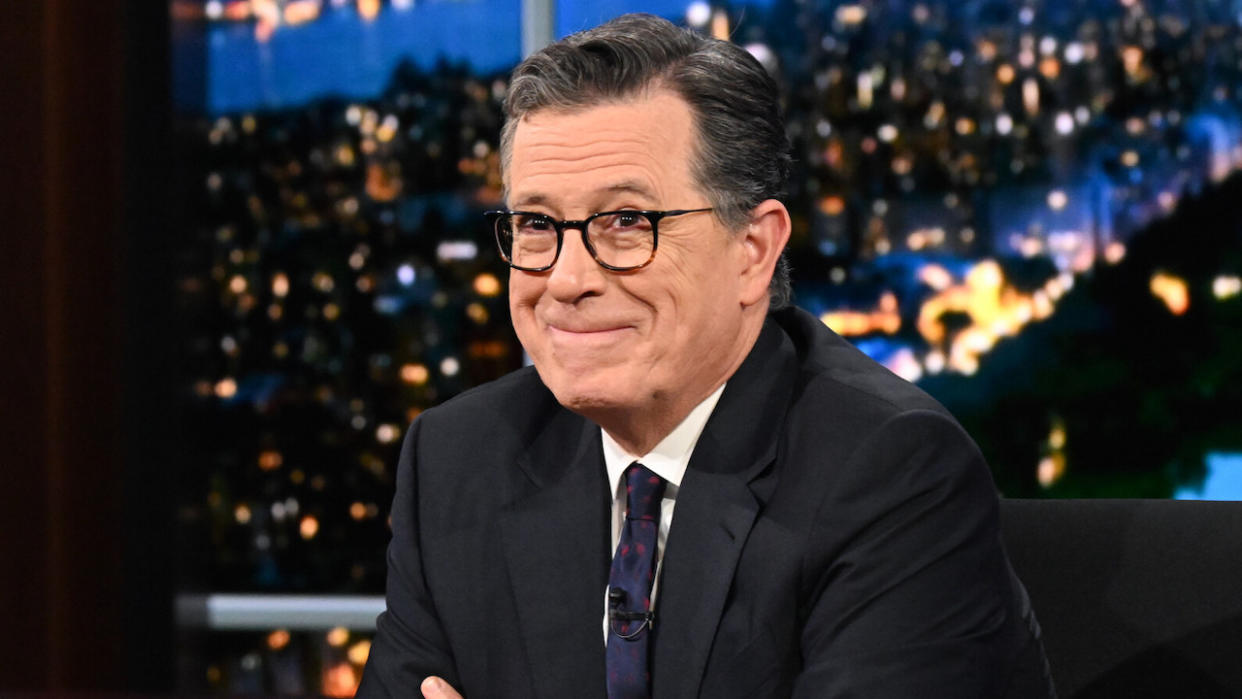  Stephen Colbert biting his lip trying not to laugh while interviewing Chris Hemsworth on The Late Show. 