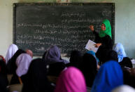 A teacher teaches Arabic language to Muslim students inside a classroom at Al-Markazie islamic institute in Balo-i town, Lanao Del Norte, southern Philippines, September 9, 2017. Picture taken September 9, 2017. REUTERS/Romeo Ranoco