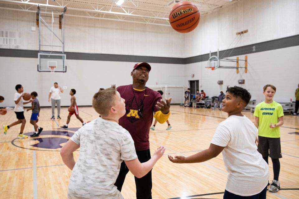 Top City Crushers program director Tobian Thomas tosses a jump ball during practice at Hillcrest Community Center on Sunday afternoon.