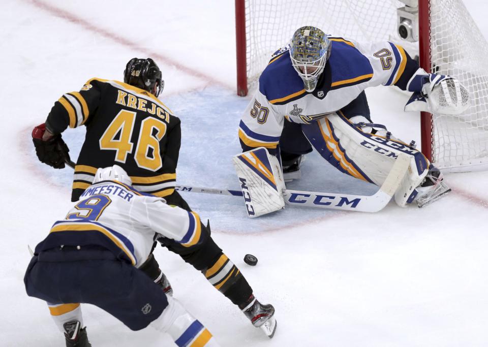 <p>St. Louis Blues goaltender Jordan Binnington, right, defends against Boston Bruins' David Krejci (46), of the Czech Republic, during the first period in Game 7 of the NHL hockey Stanley Cup Final on June 12, 2019, in Boston. (AP Photo/Charles Krupa)</p>