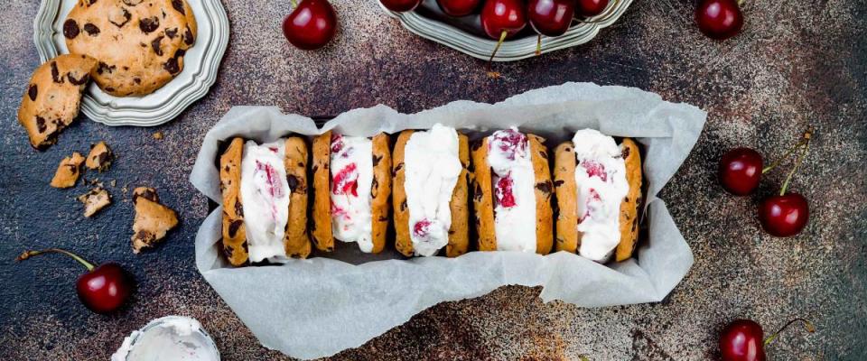 Homemade Black Forest roasted cherry ice cream sandwiches with chocolate chip cookies. Overhead, top view