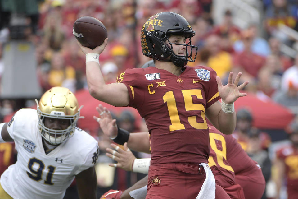 Iowa State quarterback Brock Purdy (15) throws a pass in front of Notre Dame defensive lineman Adetokunbo Ogundeji (91) during the first half of the Camping World Bowl NCAA college football game Saturday, Dec. 28, 2019, in Orlando, Fla. (AP Photo/Phelan M. Ebenhack)