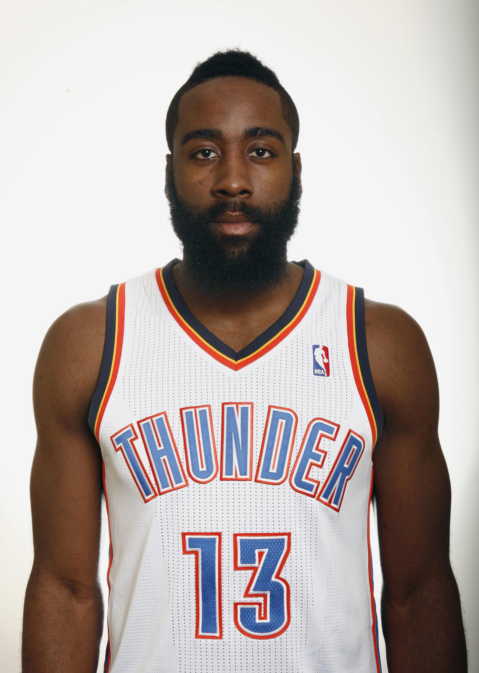 In this Dec. 13, 2011, photo, Oklahoma City Thunder's James Harden poses for a photo during the NBA basketball team's media day in Oklahoma City. The Thunder have traded Sixth Man of the Year Harden to the Houston Rockets, breaking up the young core of the Western Conference champions. The Thunder acquired guards Kevin Martin and Jeremy Lamb, two first-round picks and a second-round pick in the surprising deal that was completed Saturday night, Oct. 27, 2012. Oklahoma City also sent center Cole Aldrich, and forwards Daequan Cook and Lazar Hayward to Houston. (AP Photo/Alonzo Adams, File)