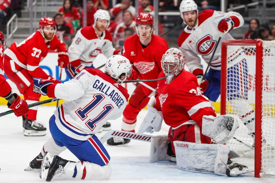 Detroit Red Wings goaltender Alex Lyon (34) makes a save against Montreal Canadiens right wing Brendan Gallagher (11) during the second period at Little Caesars Arena in Detroit on Monday, April 15, 2024.