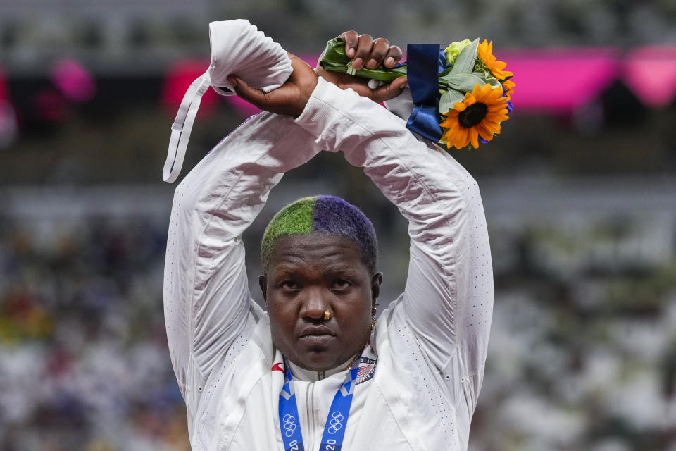 FILE - Raven Saunders, of the United States, poses with her silver medal in women's shot put at the 2020 Summer Olympics, Sunday, Aug. 1, 2021, in Tokyo, Japan. Saunders, the silver-medal shot putter who used her platform at the Tokyo Olympics to bring attention to social injustice, has been suspended for 18 months for failing to show up for doping tests. The U.S. Anti-Doping Agency announced the sanction Wednesday, March 15, 2023, for the 26-year-old, saying she had committed three “whereabouts failures” within a 12-month period ending on Aug. 15, 2022. (AP Photo/Francisco Seco, File)