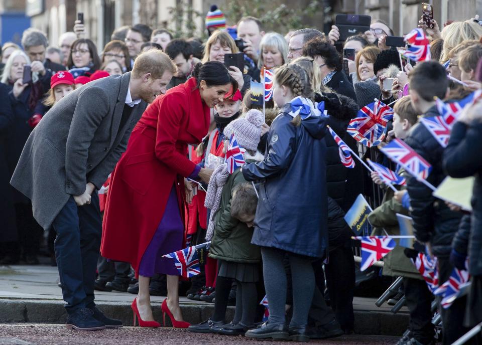 Prince Harry and Meghan chatted with a few children in Hamilton Square on their way to see a new statue marking the 100th anniversary of the death of poet Wilfred Owen in Birkenhead in January.