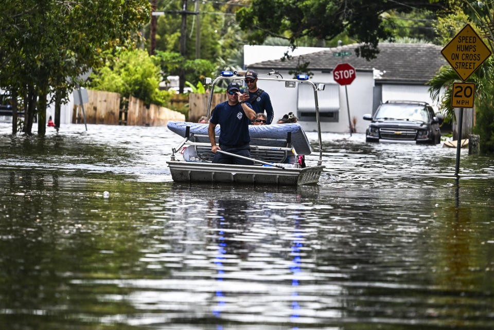 People in rafts in deep water