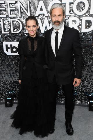 <p>Kevin Mazur/Getty</p> Winona Ryder and Scott Mackinlay Hahn on Jan. 19, 2020