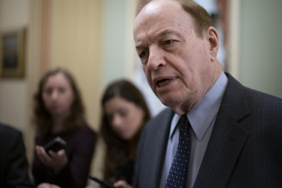 FILE - Sen. Richard Shelby, R-Ala., a senior member of the Senate Finance Committee, is asked by reporters at the Capitol in Washington, Feb. 13, 2020. Shelby attained $126 million, in the government-wide $1.5 trillion bill President Joe Biden signed recently, for two campuses of the University of Alabama, his alma mater, including for an endowment for its flagship Tuscaloosa campus to hire science and engineering faculty. (AP Photo/J. Scott Applewhite, File)