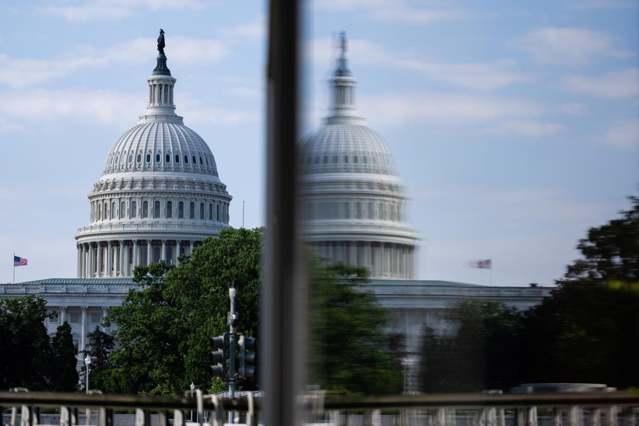 The U.S. Capitol, reflected in a window outside of the Hall of the States in Washington, D.C., June 28, 2024.(Eric Lee/The New York Times)