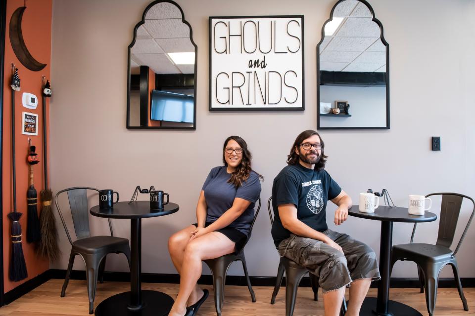 Ghouls and Grinds owner Amber Mitchell poses for a photo with her fiancée Martin Horn on Tuesday, August 6, 2019. Horn is a graphic designer who created the shop's signage.