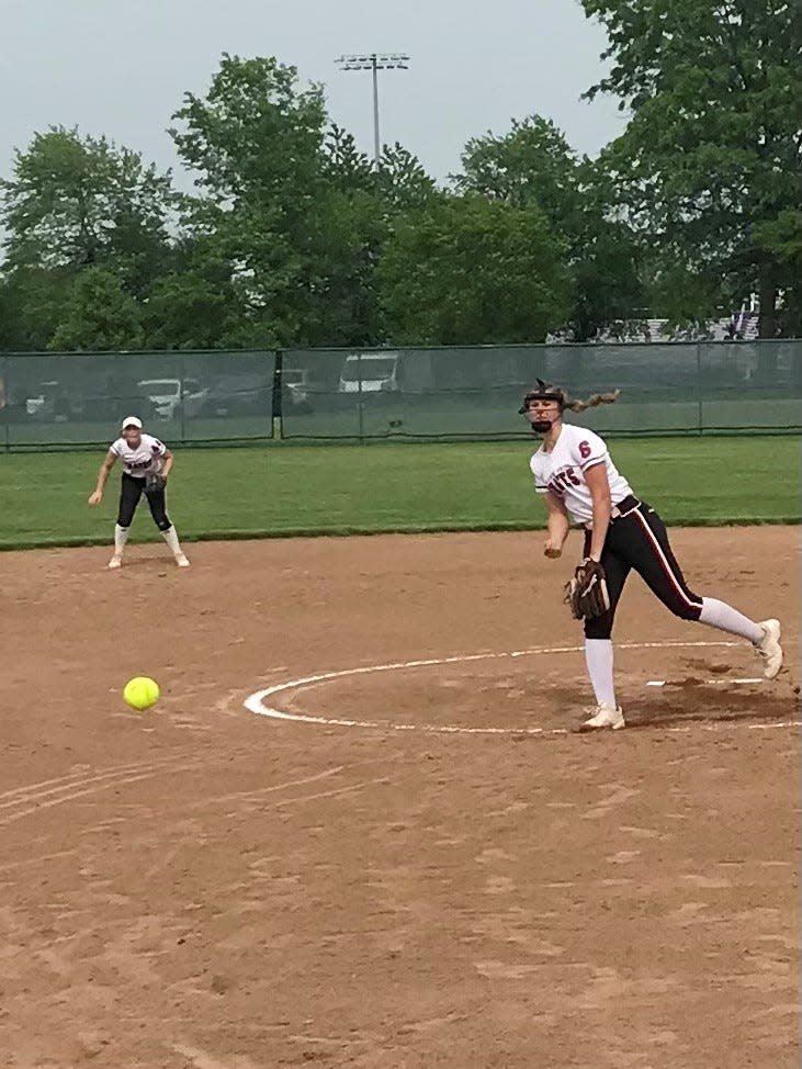 Cardington's Genevieve Longsdorf delivers a pitch against Centerburg during a Division III district championship softball game Friday night at Pickerington Central.