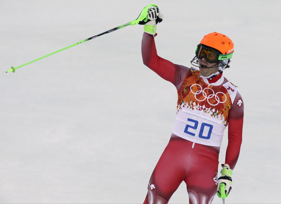 Switzerland's Sandro Viletta celebrates after finishing the slalom portion of the men's supercombined at the Sochi 2014 Winter Olympics, Friday, Feb. 14, 2014, in Krasnaya Polyana, Russia. (AP Photo/Gero Breloer)