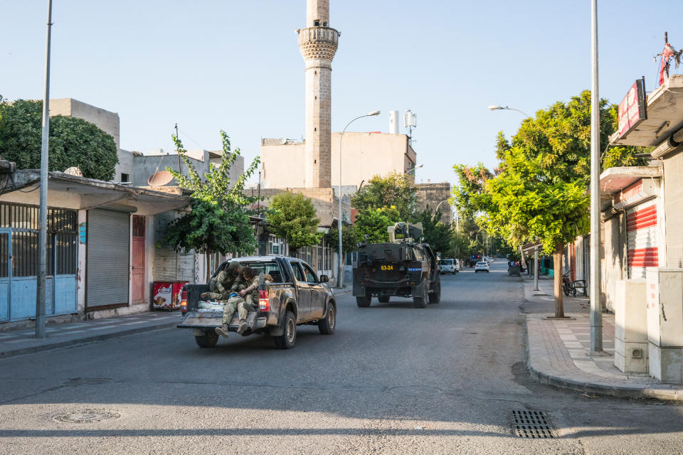 A wounded Turkish-backed Syrian fighter who was evacuated from the Syrian town of Tel Abyad is transported in a pickup truck toward the hospital in Akçakale, Turkey, on Oct. 12, 2019. | Emanuele Satolli