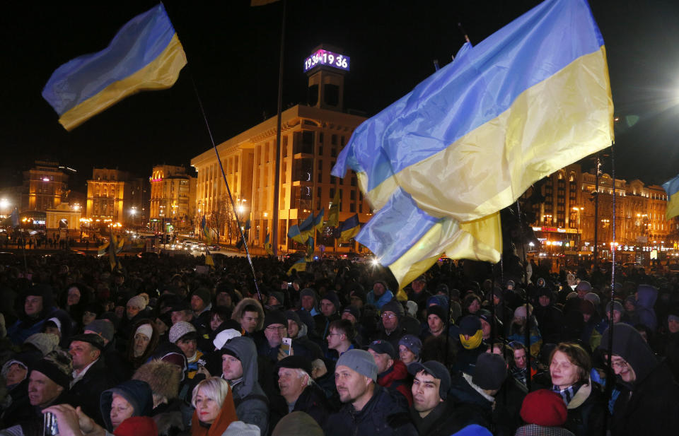 People rally to commemorate victims of clashes with security forces six years ago at the Independence Square in Kyiv, Ukraine, Thursday, Nov. 21, 2019. People mark the sixth anniversary of the beginning of the protest movement and the subsequent events in late Feb. 2014 which led to the departure of former Ukraine's President Victor Yanukovych and the formation of the new government. (AP Photo/Efrem Lukatsky)