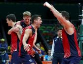 2016 Rio Olympics - Volleyball - Final - Men's Bronze Medal Match USA v Russia - Maracanazinho - Rio de Janeiro, Brazil - 21/08/2016. Thomas Jaeschke (USA) of USA and team captain David Lee (USA) of USA celebrate after the game. REUTERS/Yves Herman