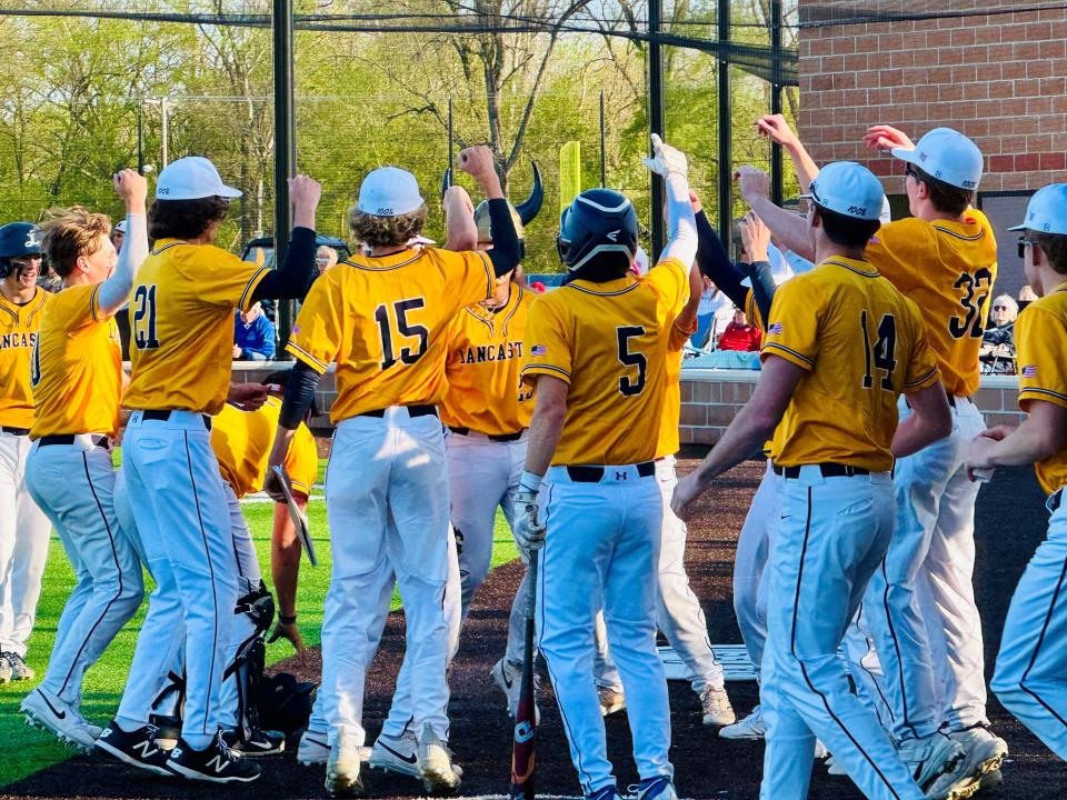 Lancaster baseball players celebrate after taking an early lead against visiting Newark on Tuesday. The Golden Gales eventually pulled out a 5-3 Ohio Capital Conference-Buckeye Division win over the Wildcats.