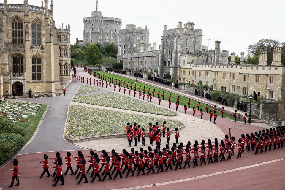 Guards walk at Windsor Castle earlier Monday (REUTERS)