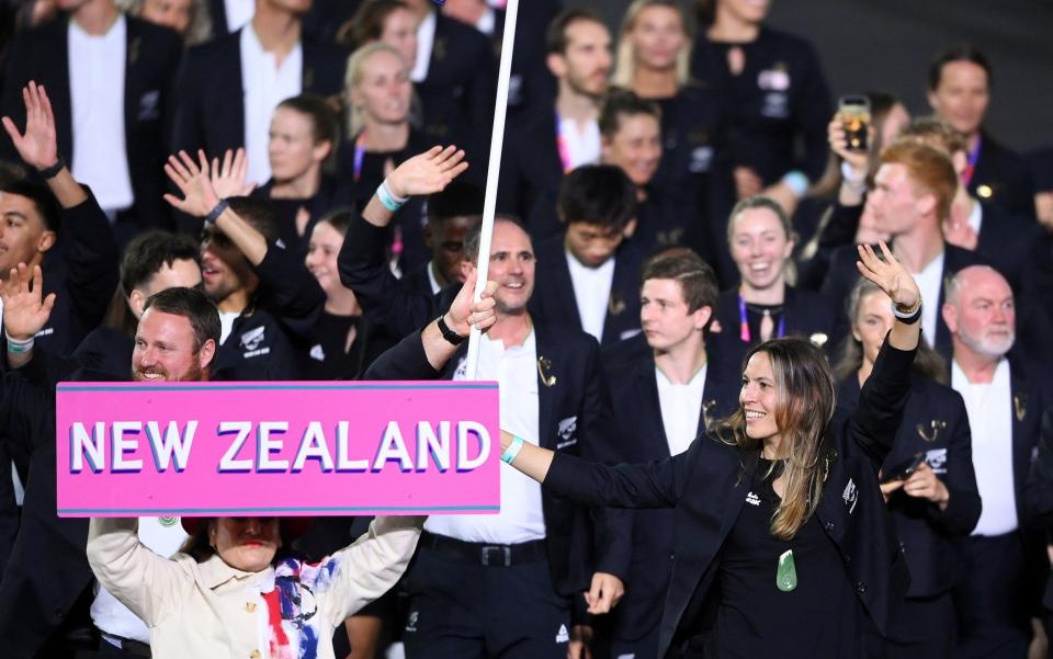 Tom Walsh and Joelle King, Flag Bearers of Team New Zealand lead their team out  - Getty Images