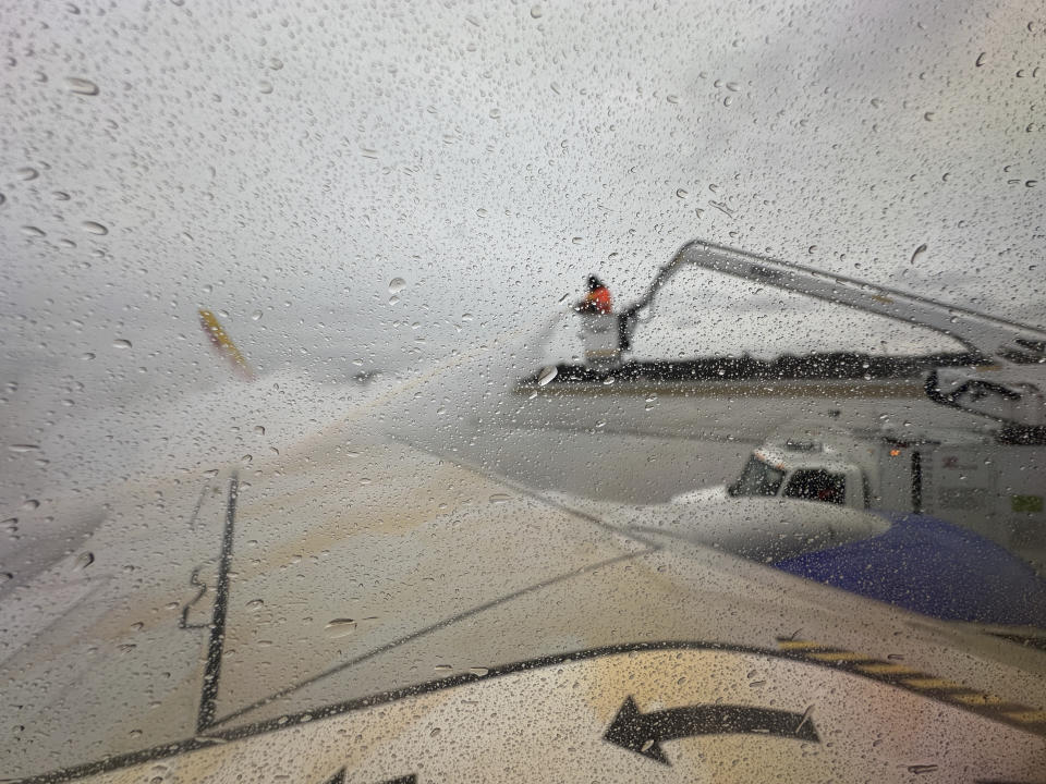 A Southwest Airlines plane is de-iced just before departing for Portland, Maine at Baltimore/Washington International Thurgood Marshall Airport in Maryland on Monday Jan. 15, 2024. A winter storm is moving from the South through to New England and the Northeast, expecting gusty winds and a mix of wintry precipitation Tuesday. (David Gruneld/The Times-Picayune/The New Orleans Advocate via AP)